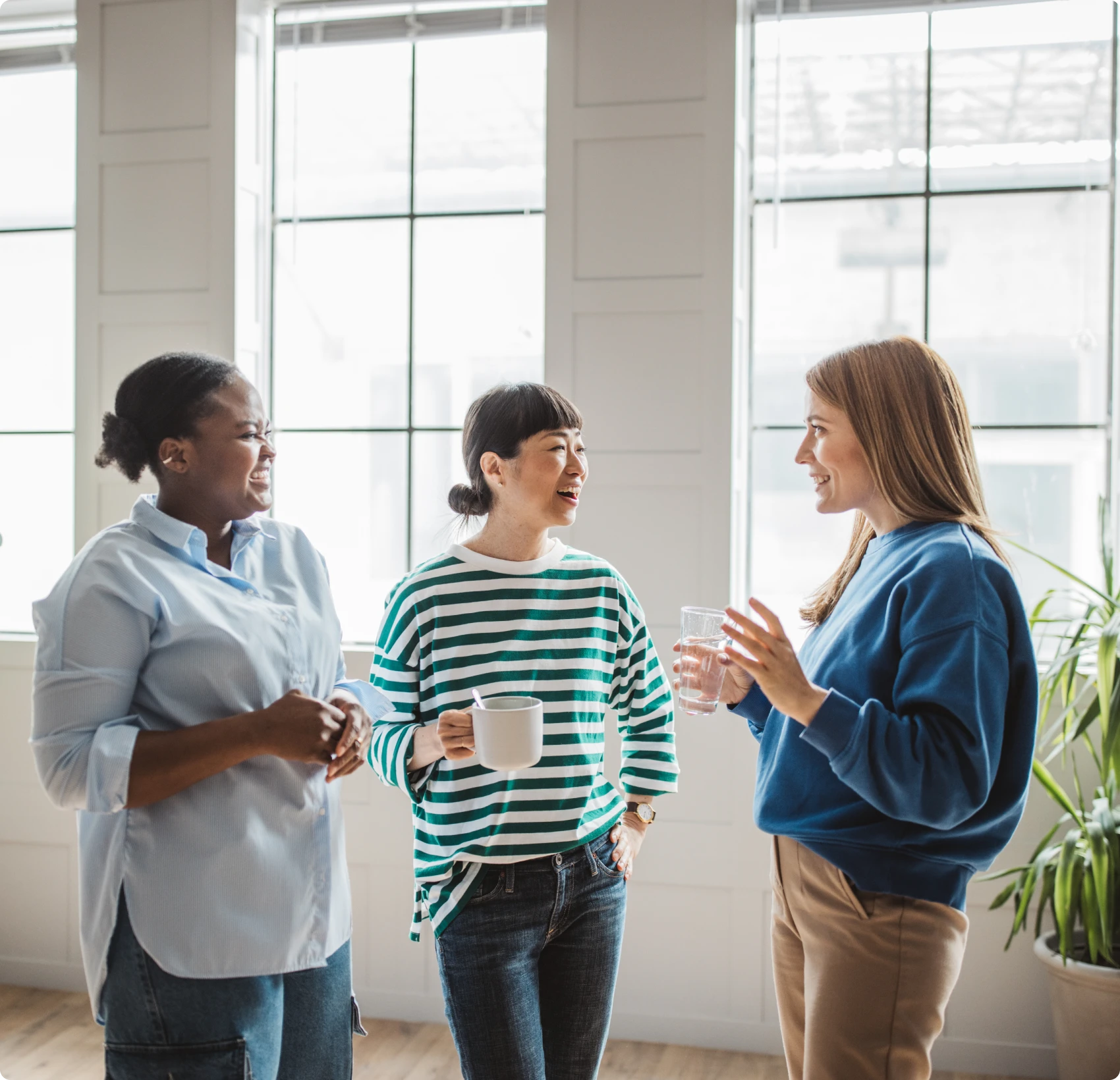 Three women enjoying coffee together